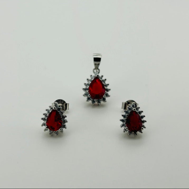 Juego plata rodio, piedra rojo  gota bisel circonias blancas